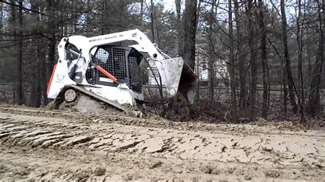 how to get skid steer unstuck|skid steer stuck in mud.